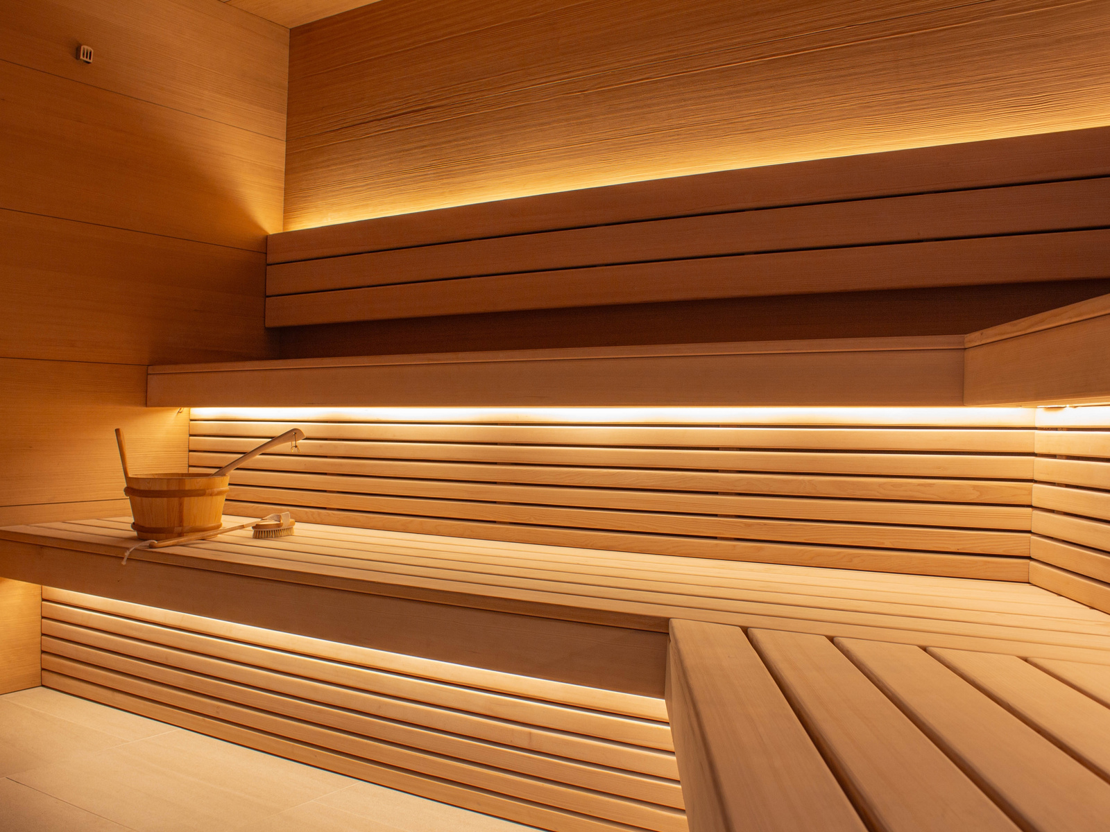 Application concept: concealed warm linear lighting above sauna benches
